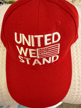 Load image into Gallery viewer, “United We Stand” hat with flag . 2 color choices ) Red or Black @ TrumpGirl.com