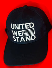 Load image into Gallery viewer, “United We Stand” hat with flag . 2 color choices ) Red or Black @ TrumpGirl.com